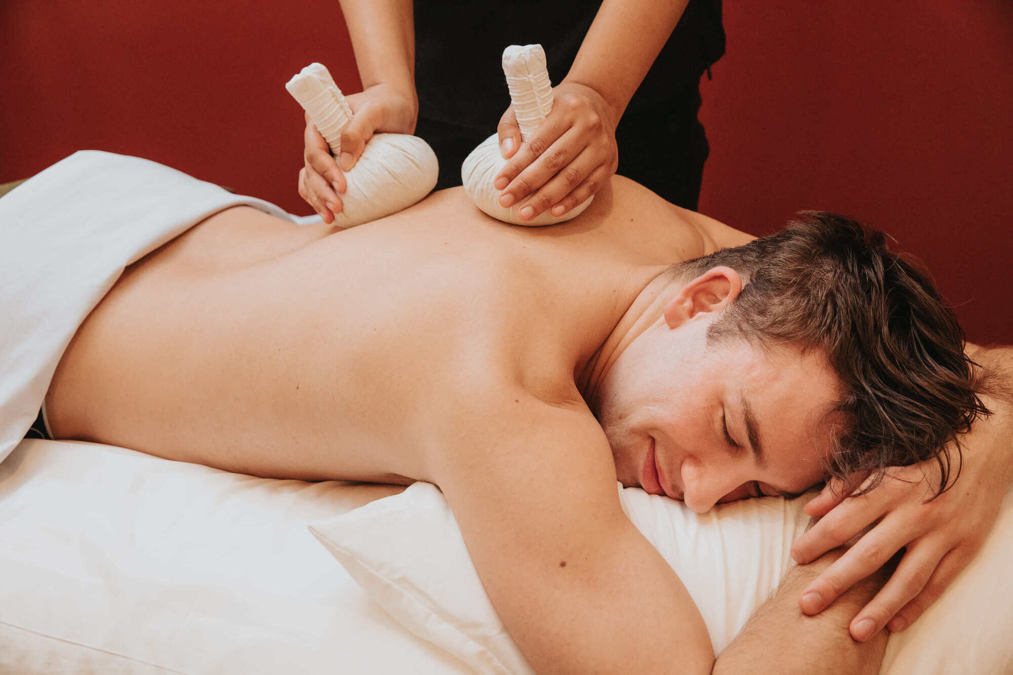 A man enjoying a professional back massage
