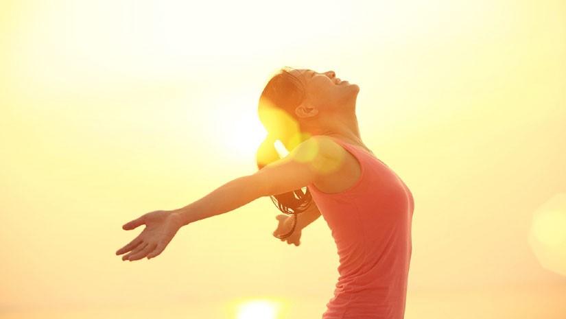 Young happy man at sunset